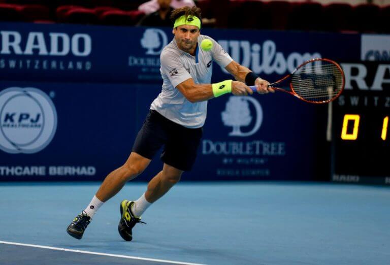 David Ferrer on the court, described by text