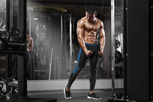 Photo of a man body building as an obsession a described by the text.