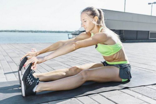 Woman touching her toes to exercise as discussed in the text.
