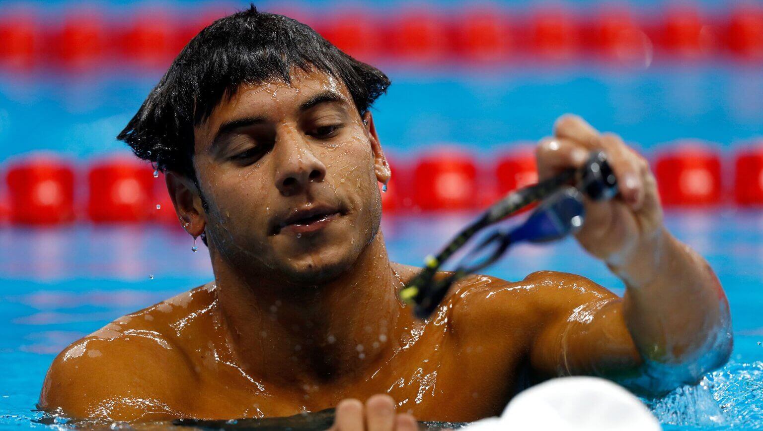 athlete rami anis competes in the swimming test