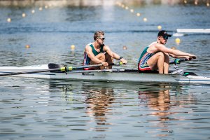Two men rowing.