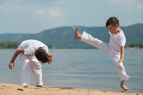Boys practicing capoeira.
