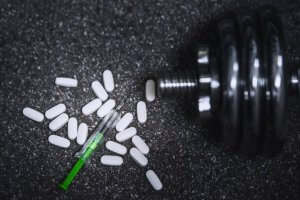 Pills, a needle, and weights.
