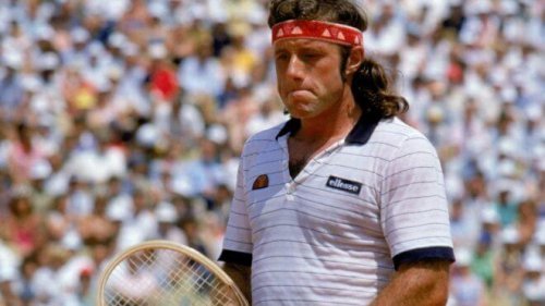 Guillermo vilas with a racket in his hand.