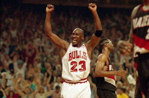 Michael Jordan who is one of the most famous athletes celebrating a victory.