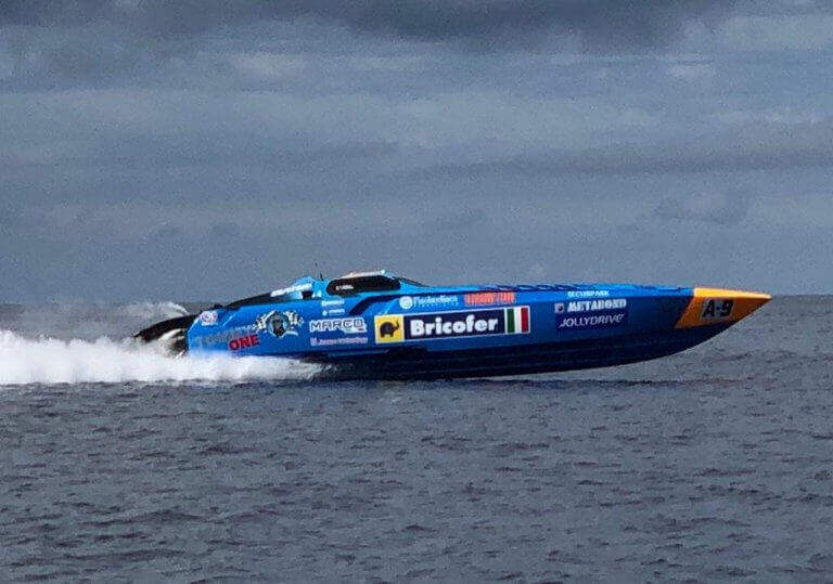 A power boating vehicle racing through the ocean