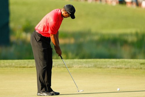 Tiger Woods hitting a ball.