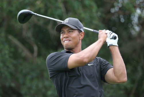 Tiger Woods swinging a golf club.