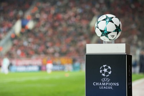 The uefa champions league ball on a podium.