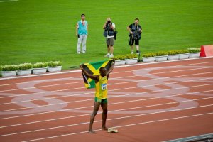 Usain Bolt with the Jamaican flag.