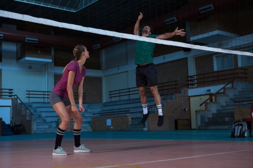 A man about to spike in volleyball.