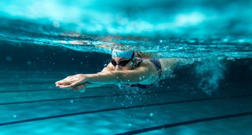 A woman enjoying the benefits of swimming.