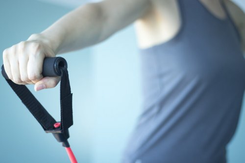 A person doing resistance band exercises.