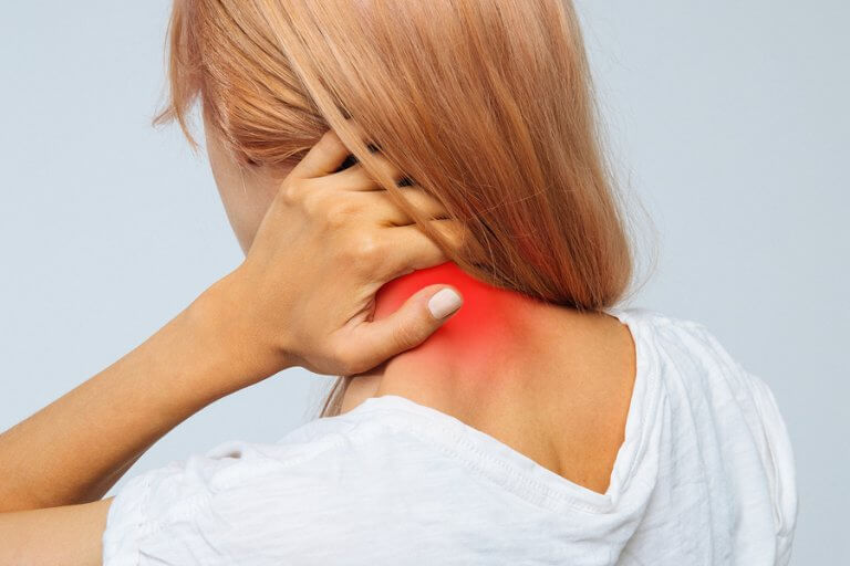 A woman with back and neck pain due to a herniated disk