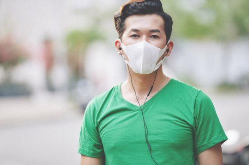 A runner practicing coronavirus prevention.