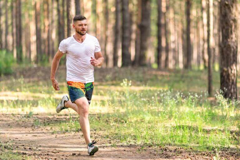 A man going out for a run through the woods