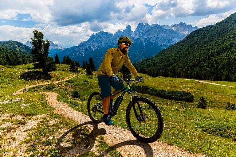 A man doing bike altitude training through a mountain