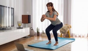 A woman performing squats.