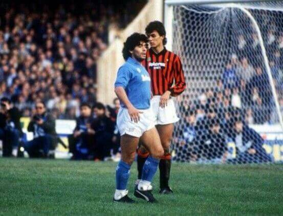 Paolo Maldini next to Diego Maradona in the middle of a stadium