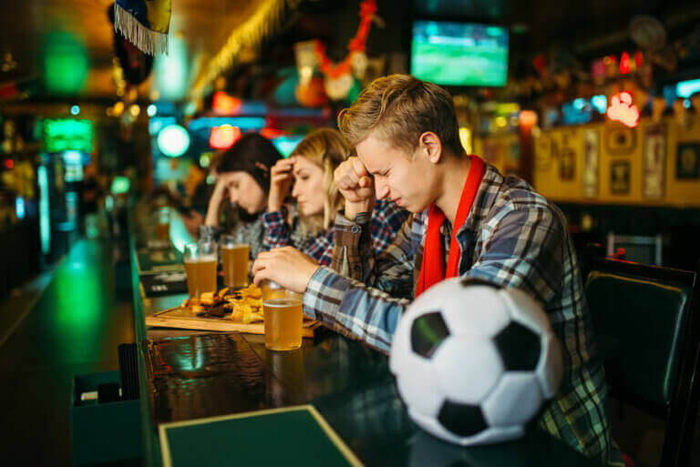Three soccer fans upset at a bar 