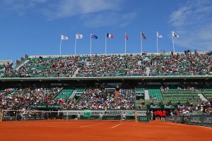 A clay tennis court during a tournament.