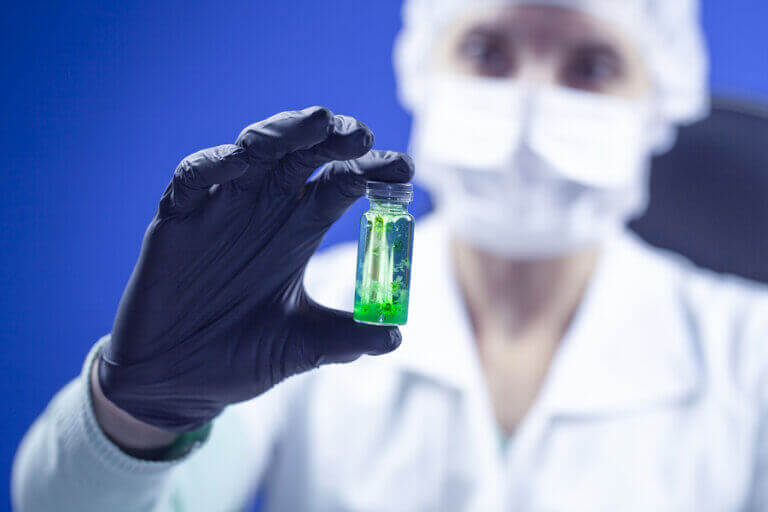 A person holding a sample while testing for coronavirus