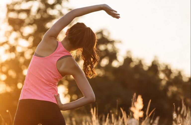 A woman doing stretching exercises during the coronavirus quarantine