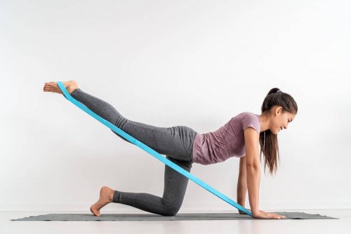 A woman doing a glute exercise.