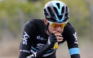 A cyclist taking an energy gel.