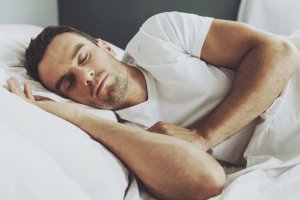 A man sleeping at home.