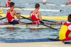Men rowing on a lake.