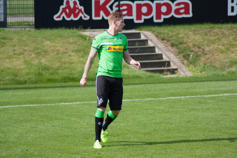 A player from one of the most winning teams in the Bundesliga standing in the middle of the field