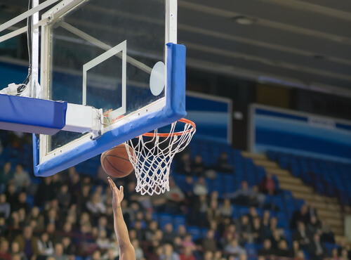 A basketball player socoring a point during the game