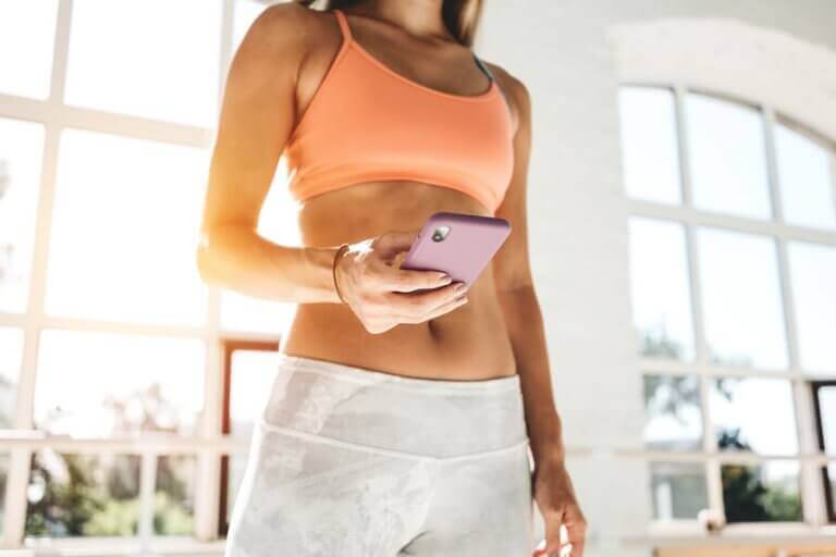 A woman following different Instagram accounts to work out during quarantine