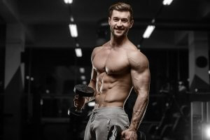 A man bodybuilding in the gym.
