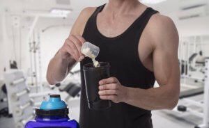 A man preparing some bodybuilding supplements.