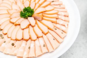 A plate of chicken and pork.