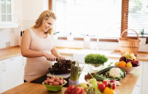 A woman cutting vegetables.