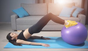 A woman exercising at home.