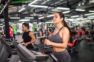A woman running on a treadmill.