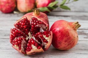 An open pomegranate on a table.