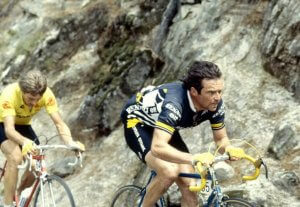 Bernard Hinault cycling through the mountains.