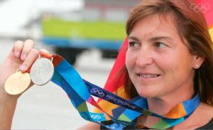 Birgit Fischer showing her gold and silver medals.