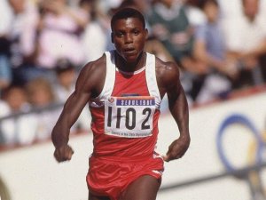 Carl Lewis taking a run up.