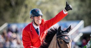 Ian Millar on a horse giving a thumbs-up.