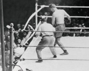 Jack Dempsey falling out of the ring during one of the most famous fights in boxing.