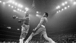 Muhammad Ali fighting Joe Frazier in one of the most famous fights in boxing.