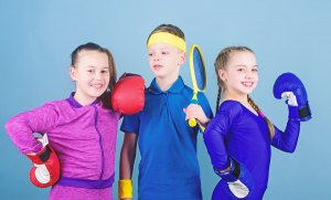 Three children ready for physical exercise.