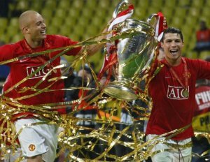 Wes Brown and Cristiano Ronaldo winning the Champions League with Manchester United.