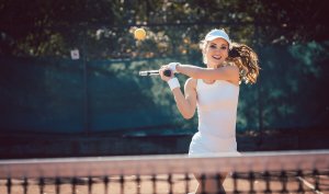 A woman playing tennis.